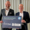 Spendenübergabe bei der Rhein Gruppe: TÜV SÜD gratuliert zum 100. Geburtstag