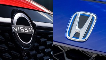 Logos der Autobauer Nissan und Honda