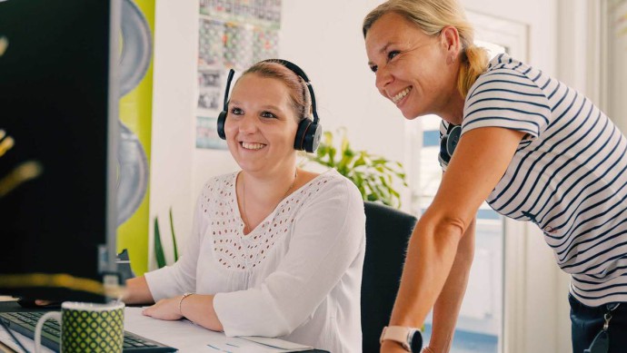 GETTYGO Kundenbetreuung lächelnde Teammitglieder bei der Arbeit